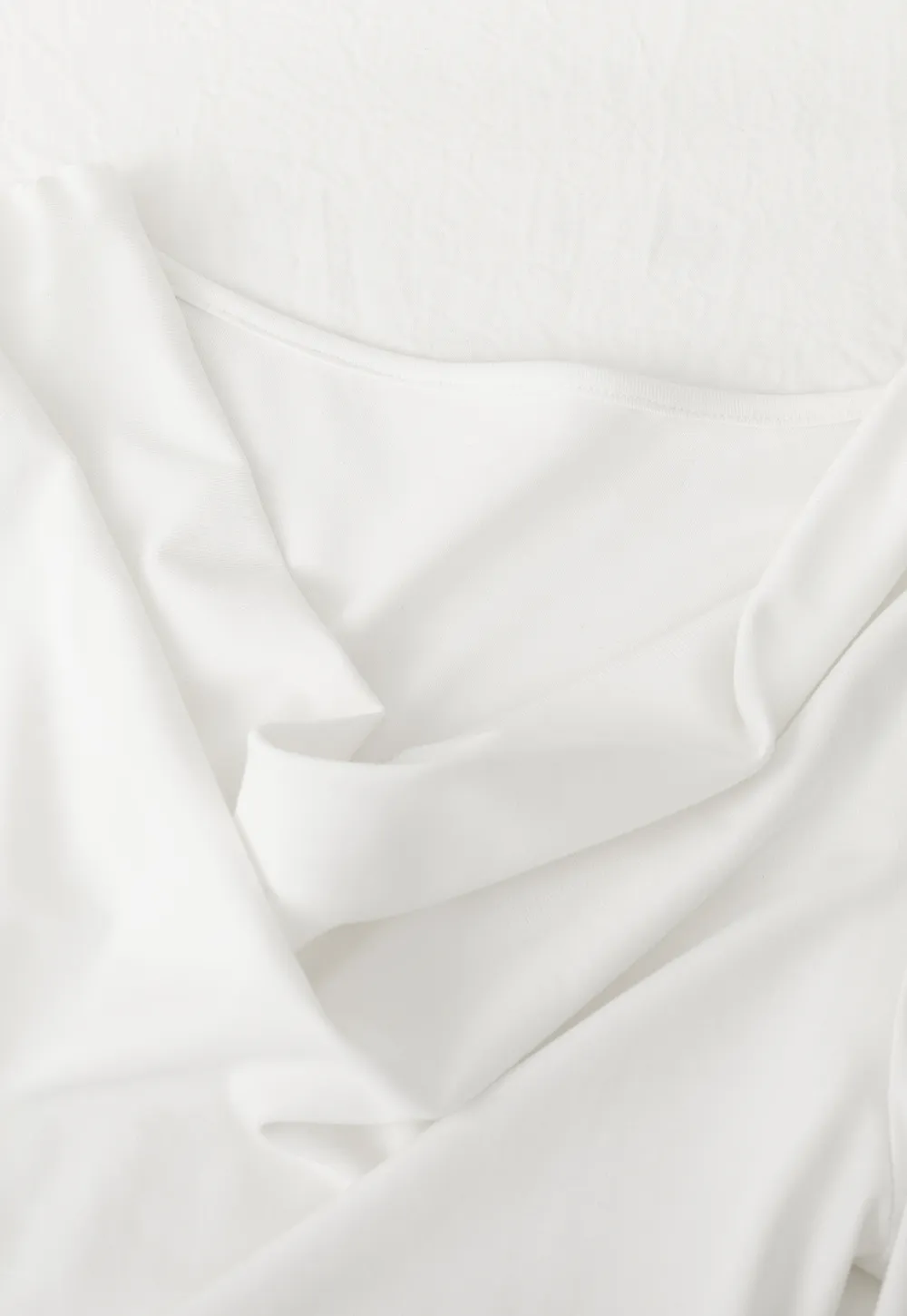 Elegant asymmetrical long sleeve dress with unique belt design