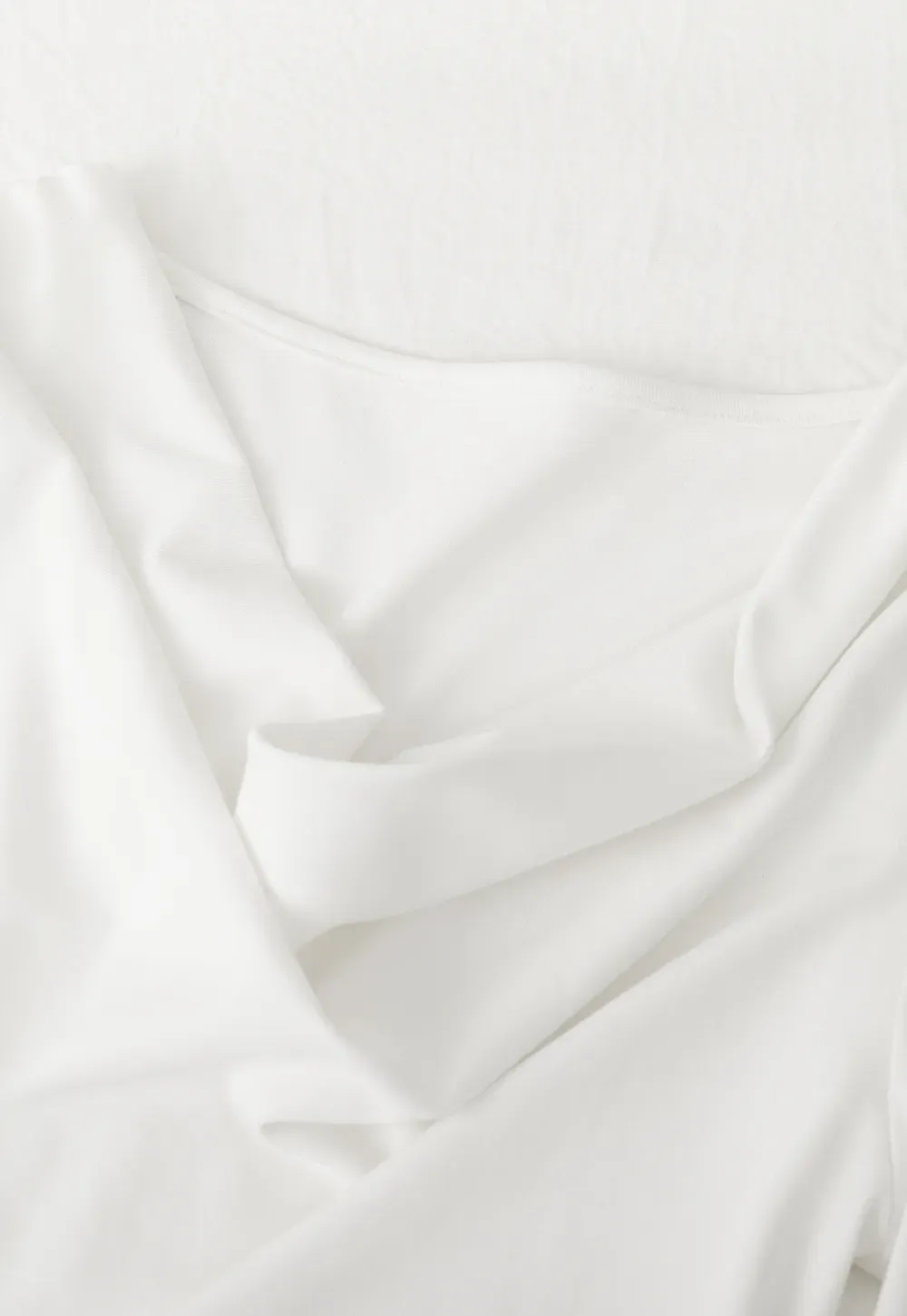 Elegant asymmetrical long sleeve dress with unique belt design