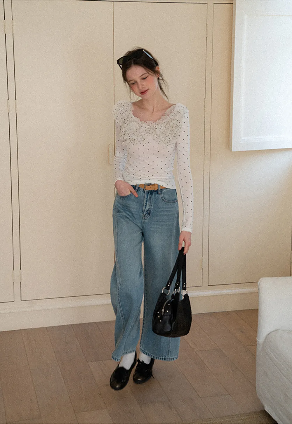 Polka dot long sleeve top with ruffled neckline