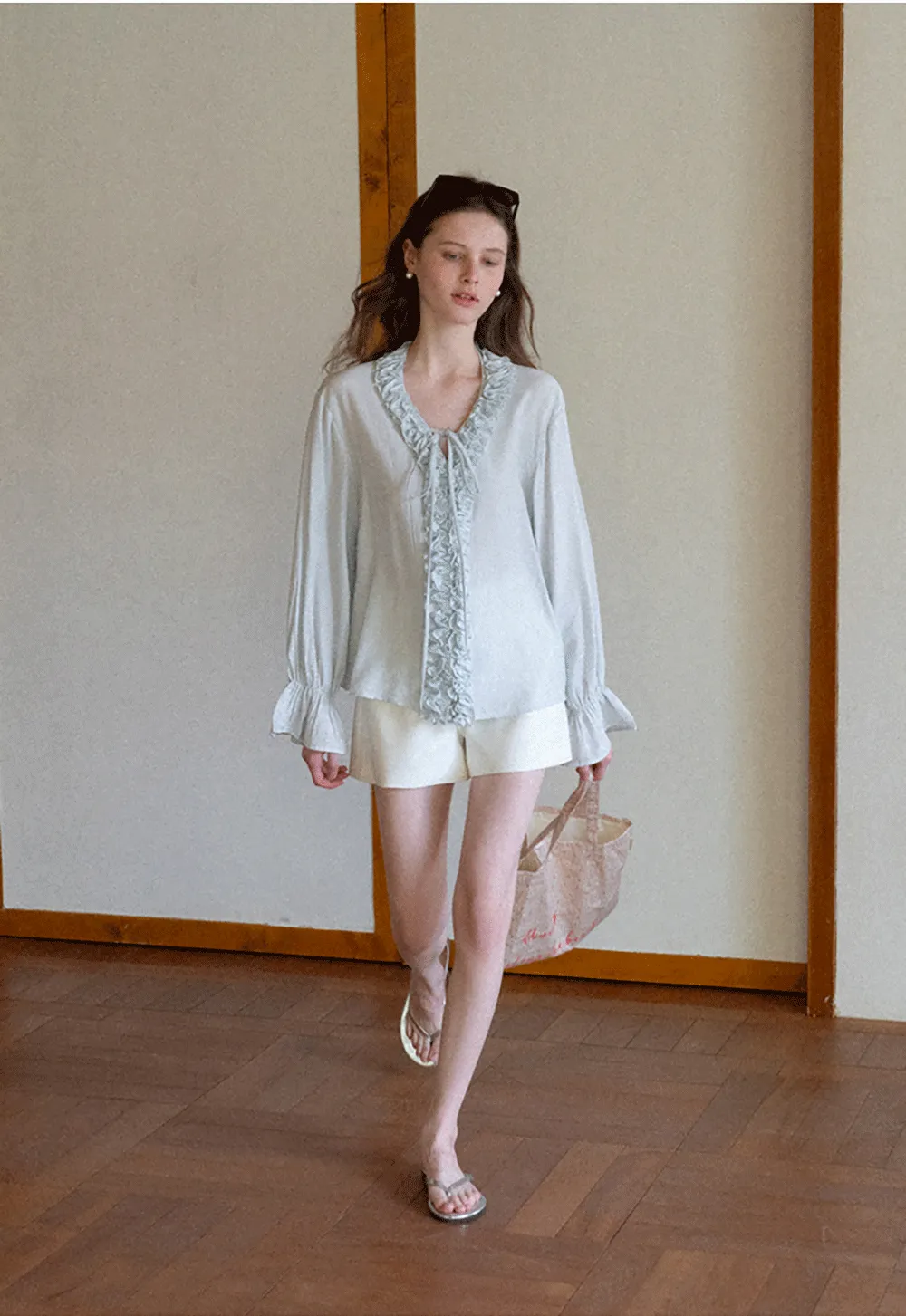 Long sleeve shirt with ruffled neckline and gathered cuffs