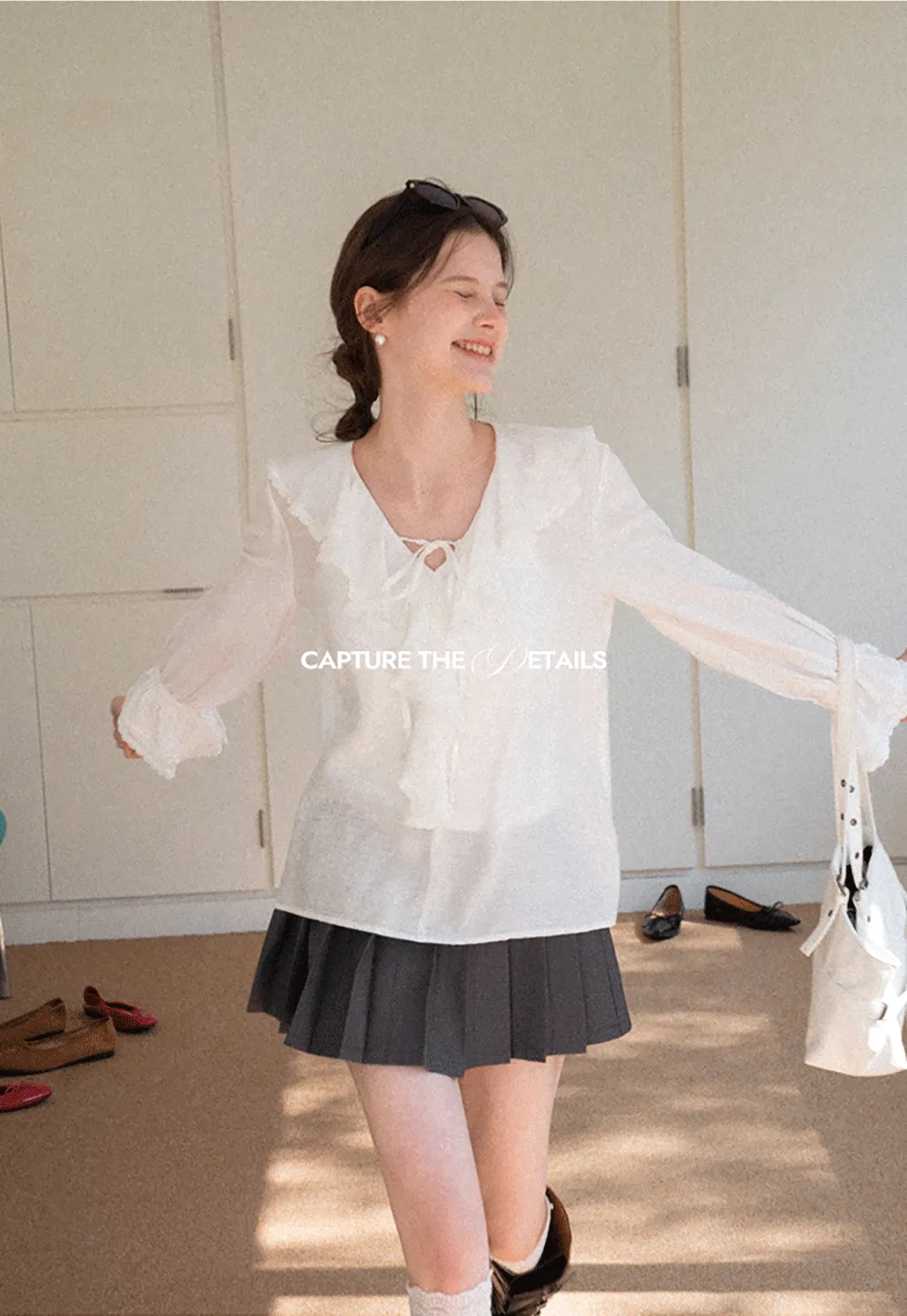 Elegant Blouse with Ruffled Neckline and Flared Sleeves