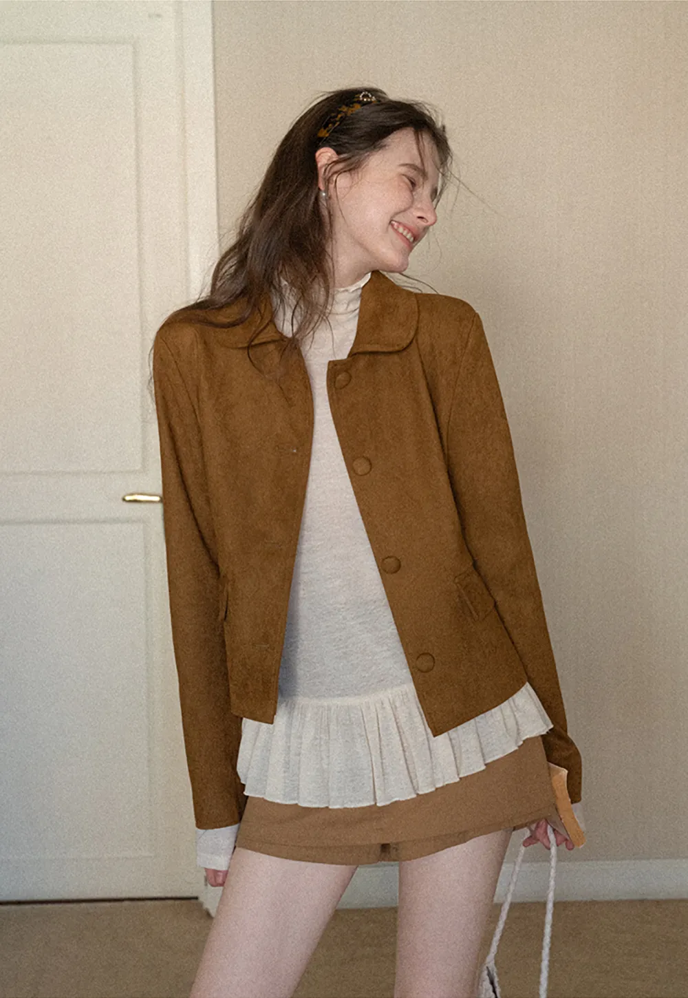 High waist pleated mini skirt with button front design