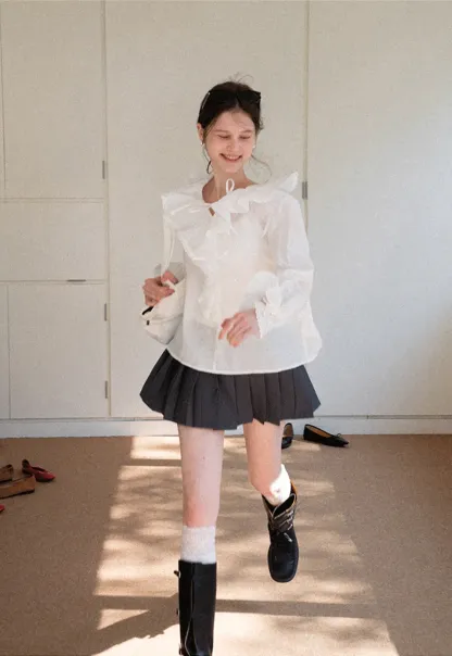 Elegant Blouse with Ruffled Neckline and Flared Sleeves