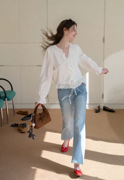 Elegant Blouse with Ruffle Detail and Tie Front Design