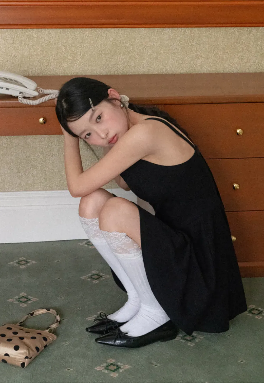 Sleeveless dress with thin straps and flared skirt