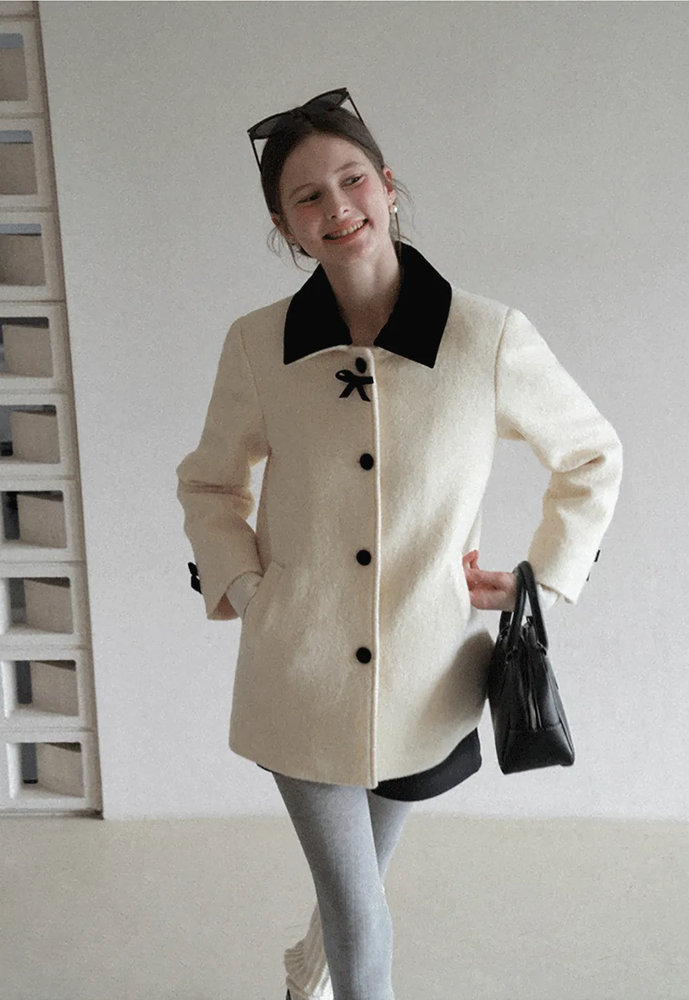 Elegant Wool Coat with Bow Detail and Contrasting Collar