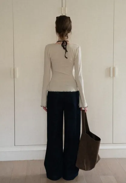 Beige Long-Sleeve Top with Ruffled Hem and Bow Tie Back