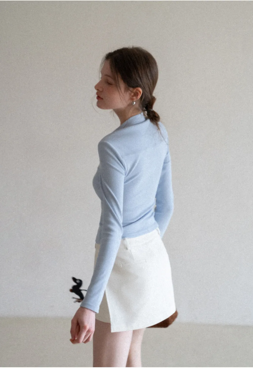 Elegant Pleated Mini Skirt with Asymmetrical Hem