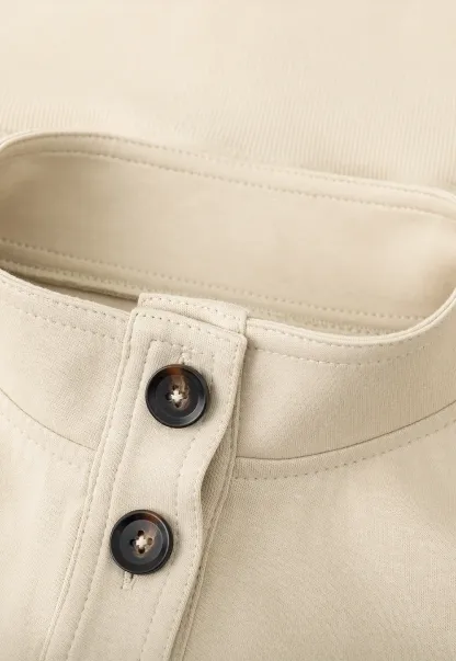 Short jacket with button front and ribbed cuffs