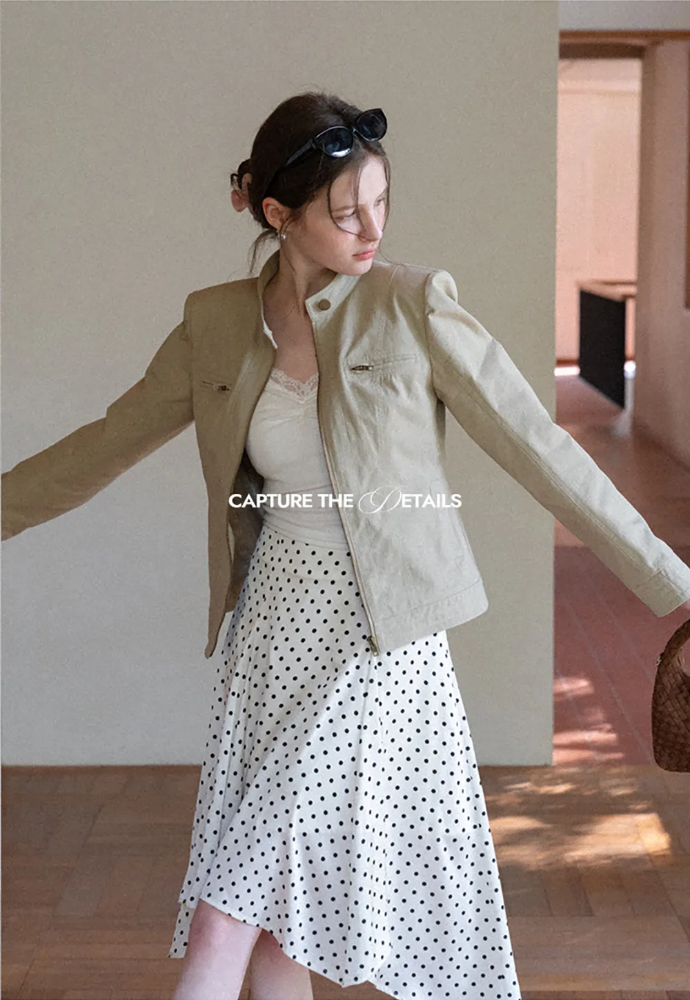 Polka dot asymmetrical hem skirt with pleats