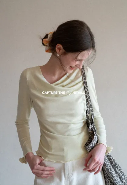 Long sleeve top with ruffled hem and cuffs