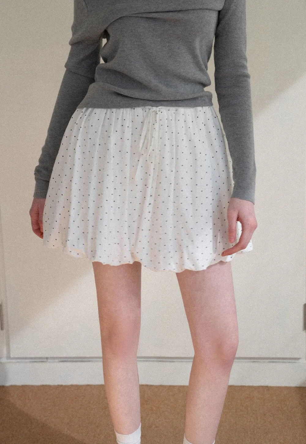 Polka dot pleated mini skirt with drawstring waist