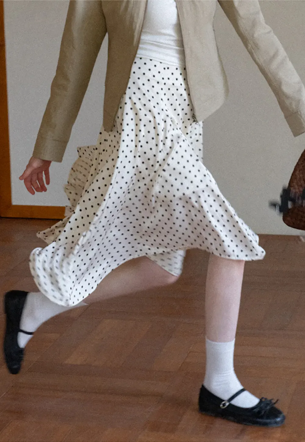 Polka dot asymmetrical hem skirt with pleats