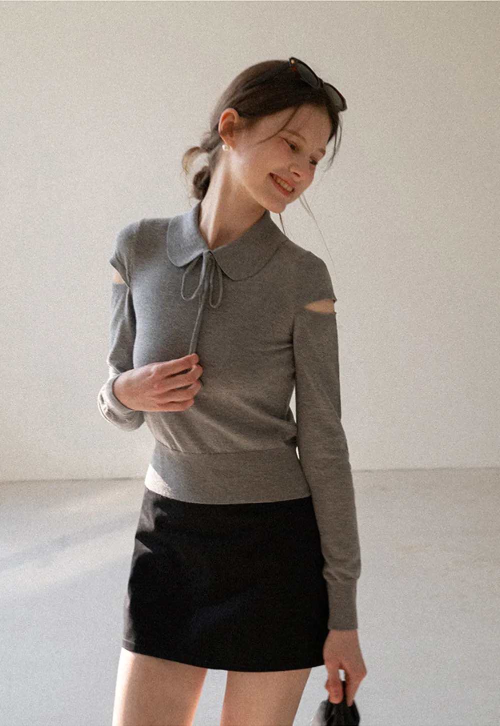 Elegant Knit Sweater with Bow Detail and Cutout Sleeves