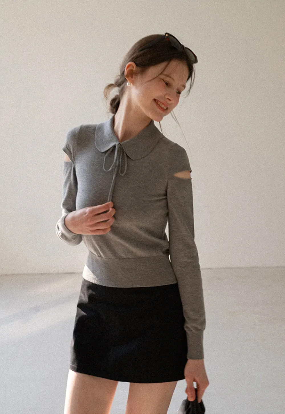 Elegant Knit Sweater with Bow Detail and Cutout Sleeves