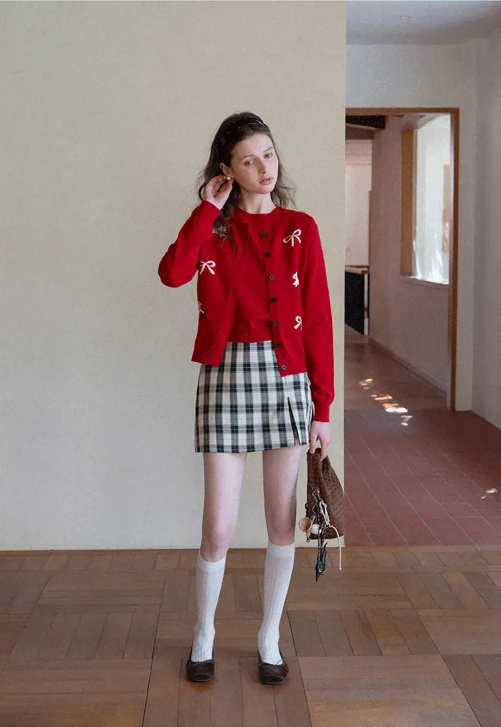 Woolen knit sweater with horse and bow motifs