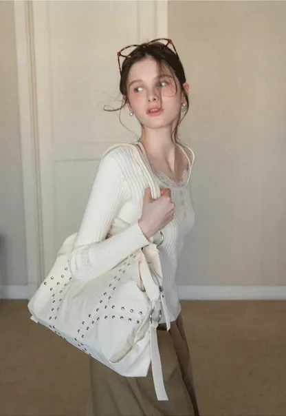 Ribbed knit sweater with boat neck and long sleeves