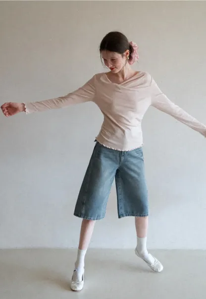 Long sleeve top with ruffled hem and cuffs