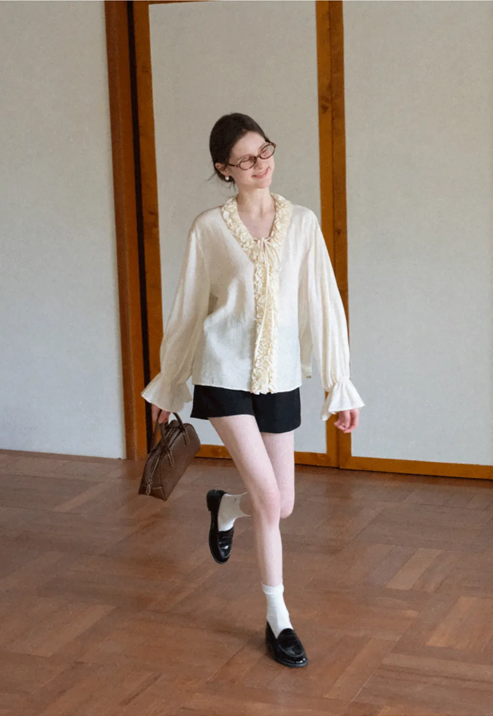 Long sleeve shirt with ruffled neckline and gathered cuffs