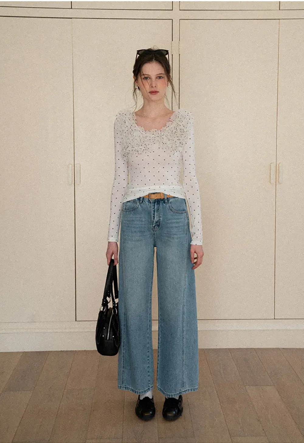 Polka dot long sleeve top with ruffled neckline