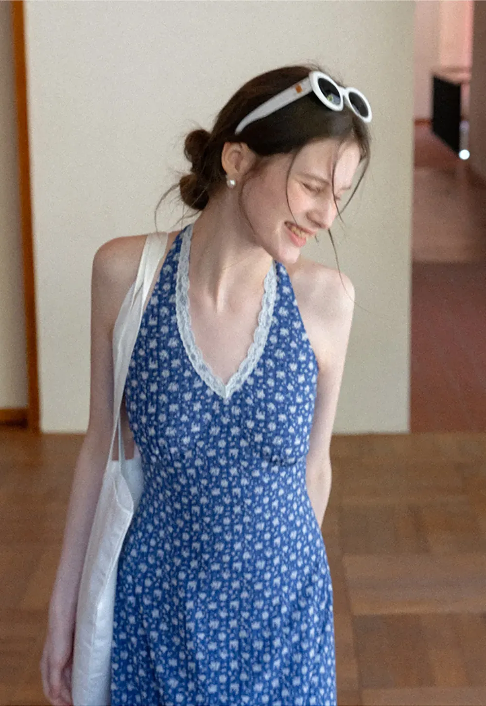 Halter neck dress with floral print and lace trim