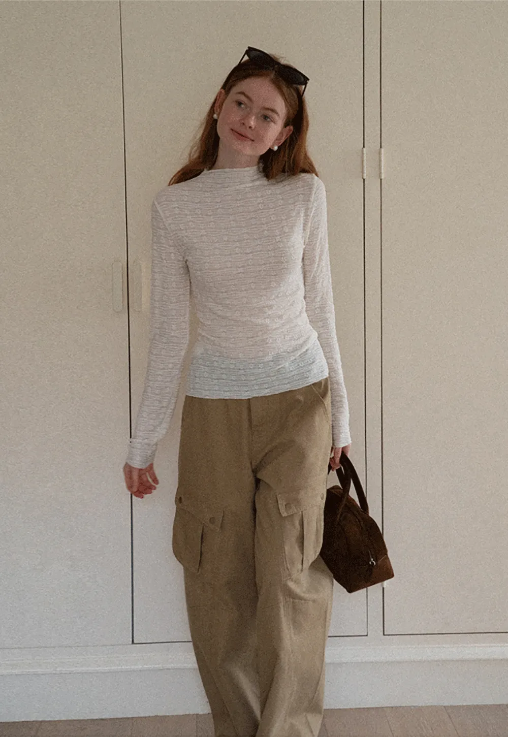 Elegant textured long sleeve top with subtle pattern design