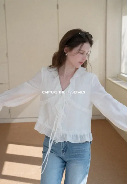 Elegant Blouse with Ruffle Detail and Tie Front Design