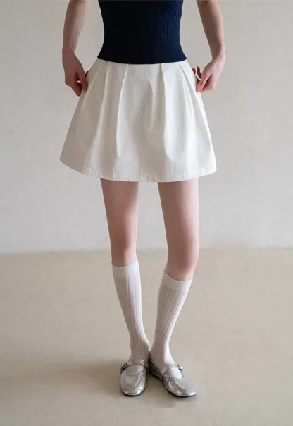 Plaid skirt with pleats and ruffled top