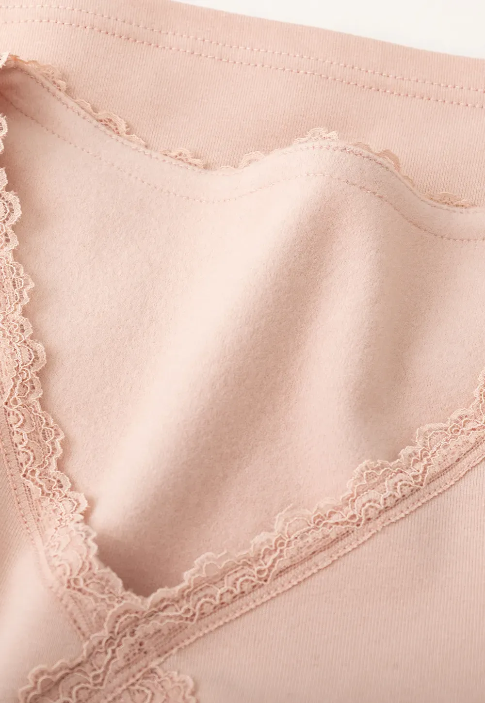 V neck long sleeve top with lace trim and fitted design