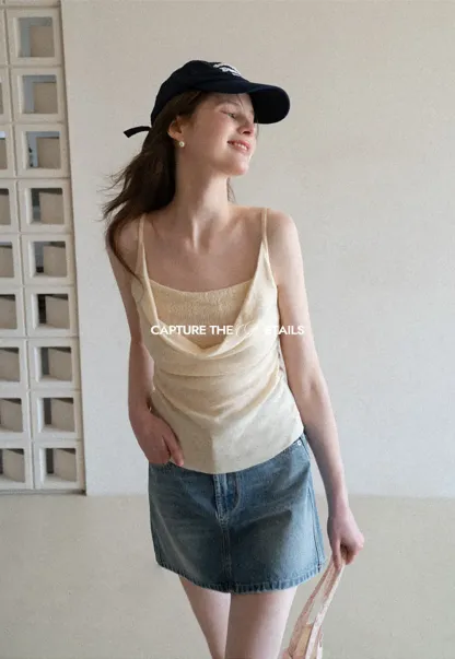 Silk-like tank top with thin straps and draped neckline