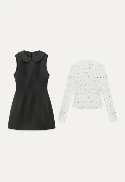 Elegant sleeveless dress with collar layered over polka dot top