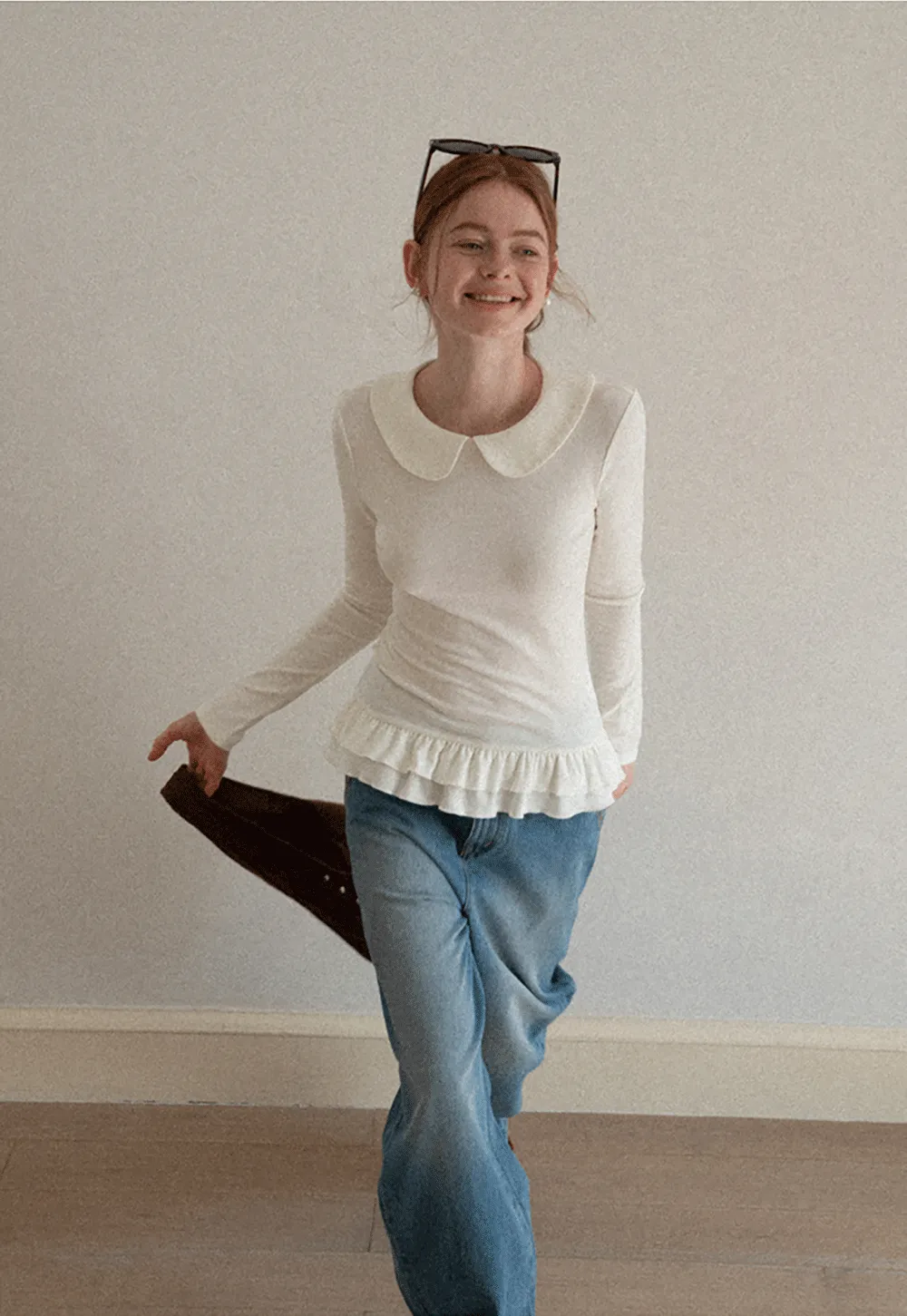 Elegant Long Sleeve Top with Ruffled Hem and Collar Design