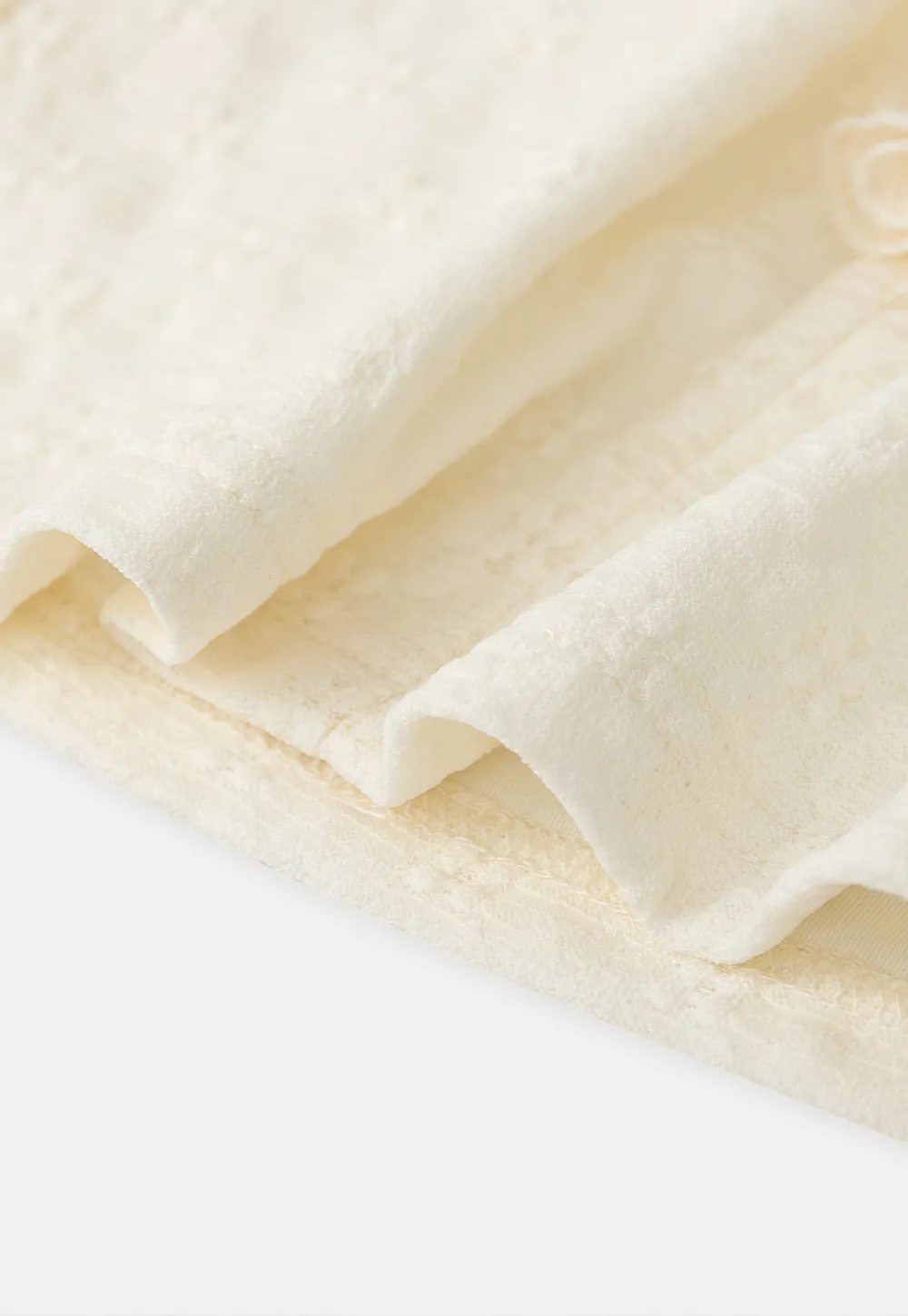 Sleeveless Top with Ruffled V Neck and Floral Detail