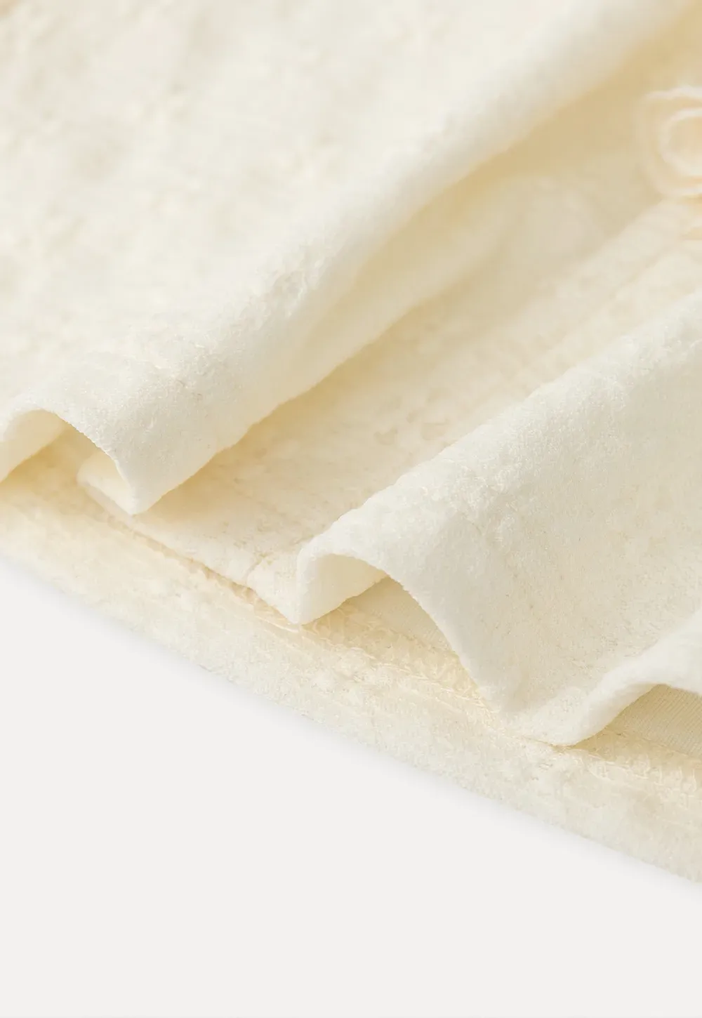 Sleeveless Top with Ruffled V Neck and Floral Detail