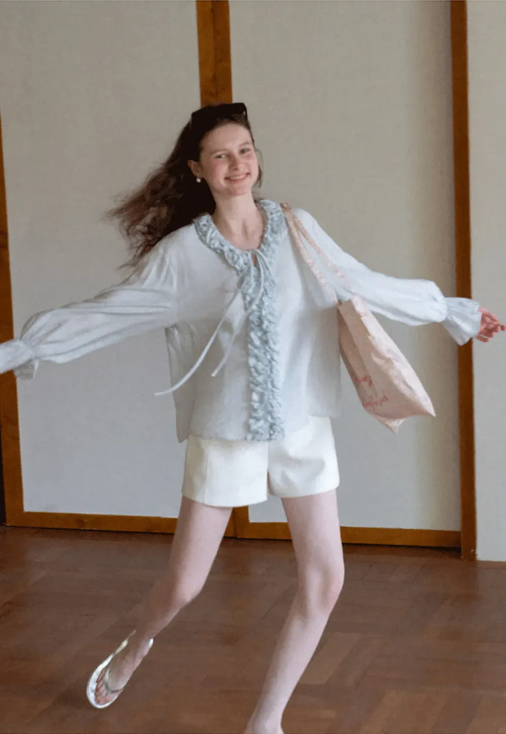 Long sleeve shirt with ruffled neckline and gathered cuffs