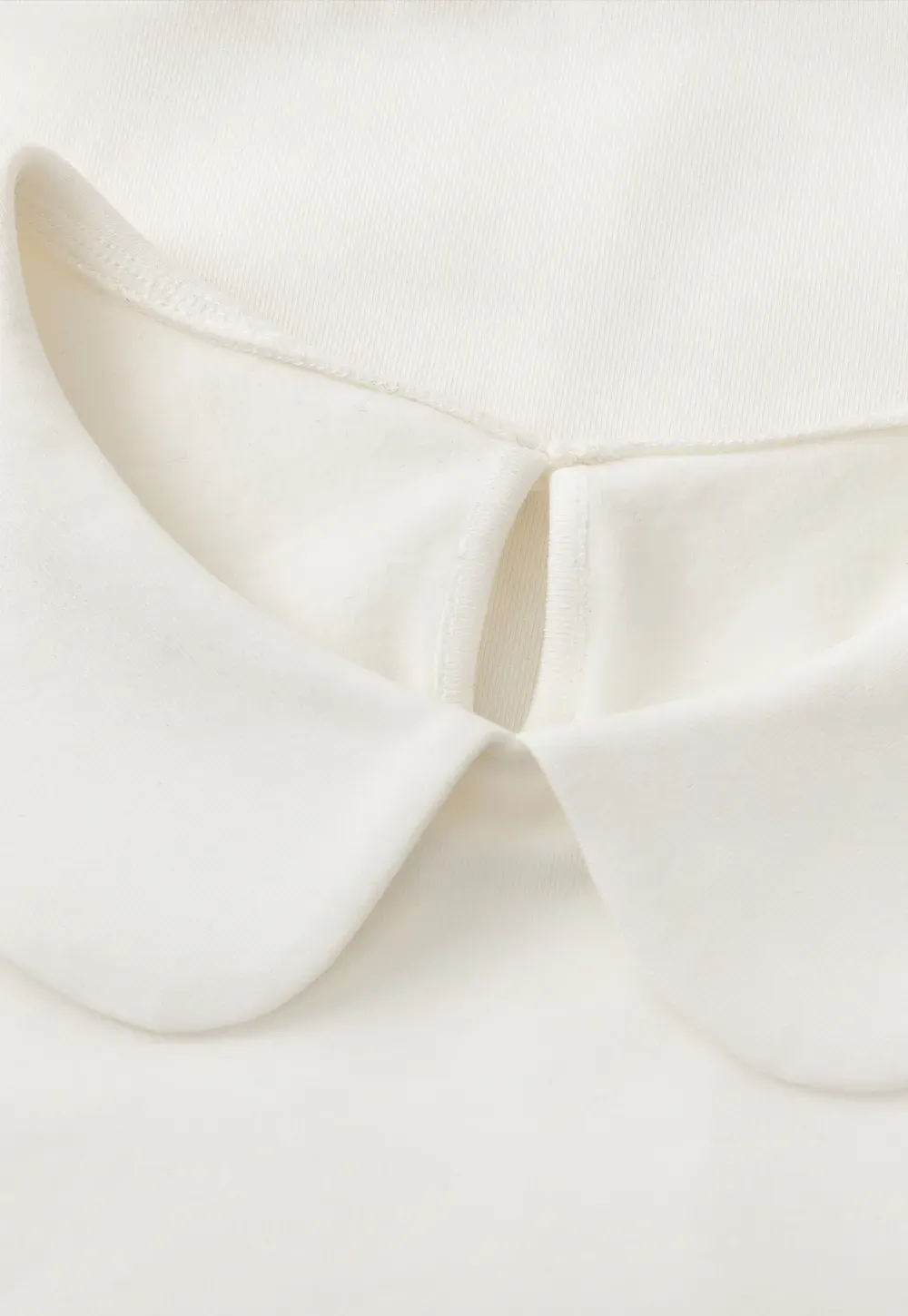 Elegant Long Sleeve Top with Ruffled Hem and Collar Design