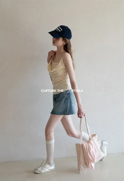 Silk-like tank top with thin straps and draped neckline