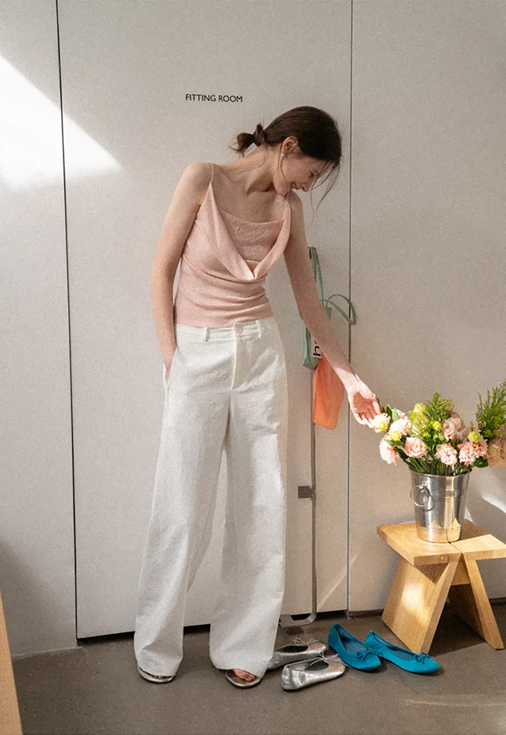 Silk-like tank top with thin straps and draped neckline