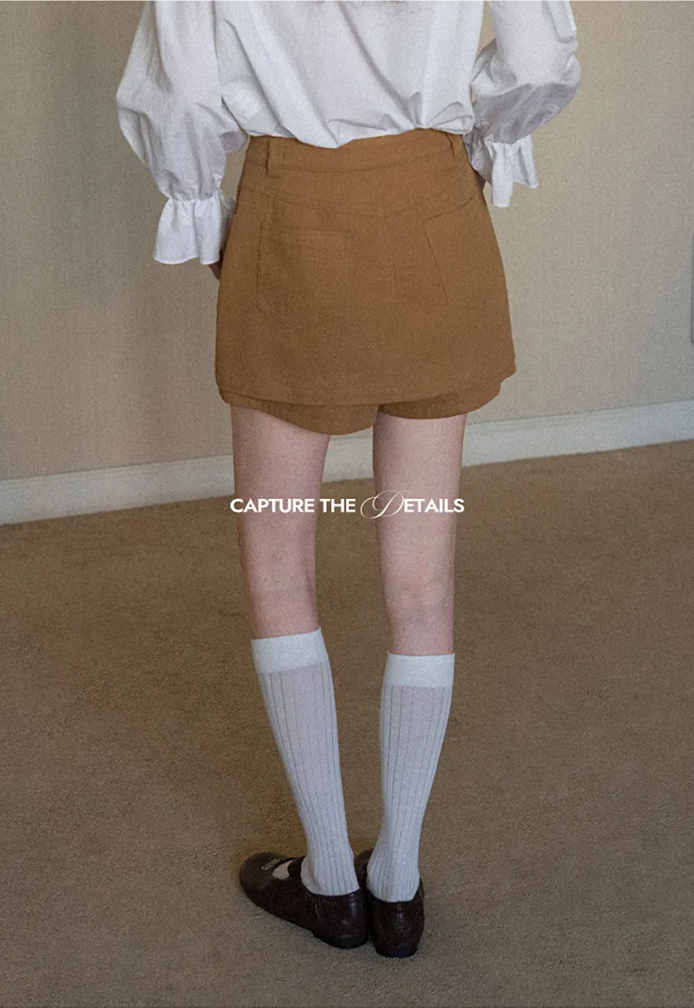 High waist pleated mini skirt with button front design