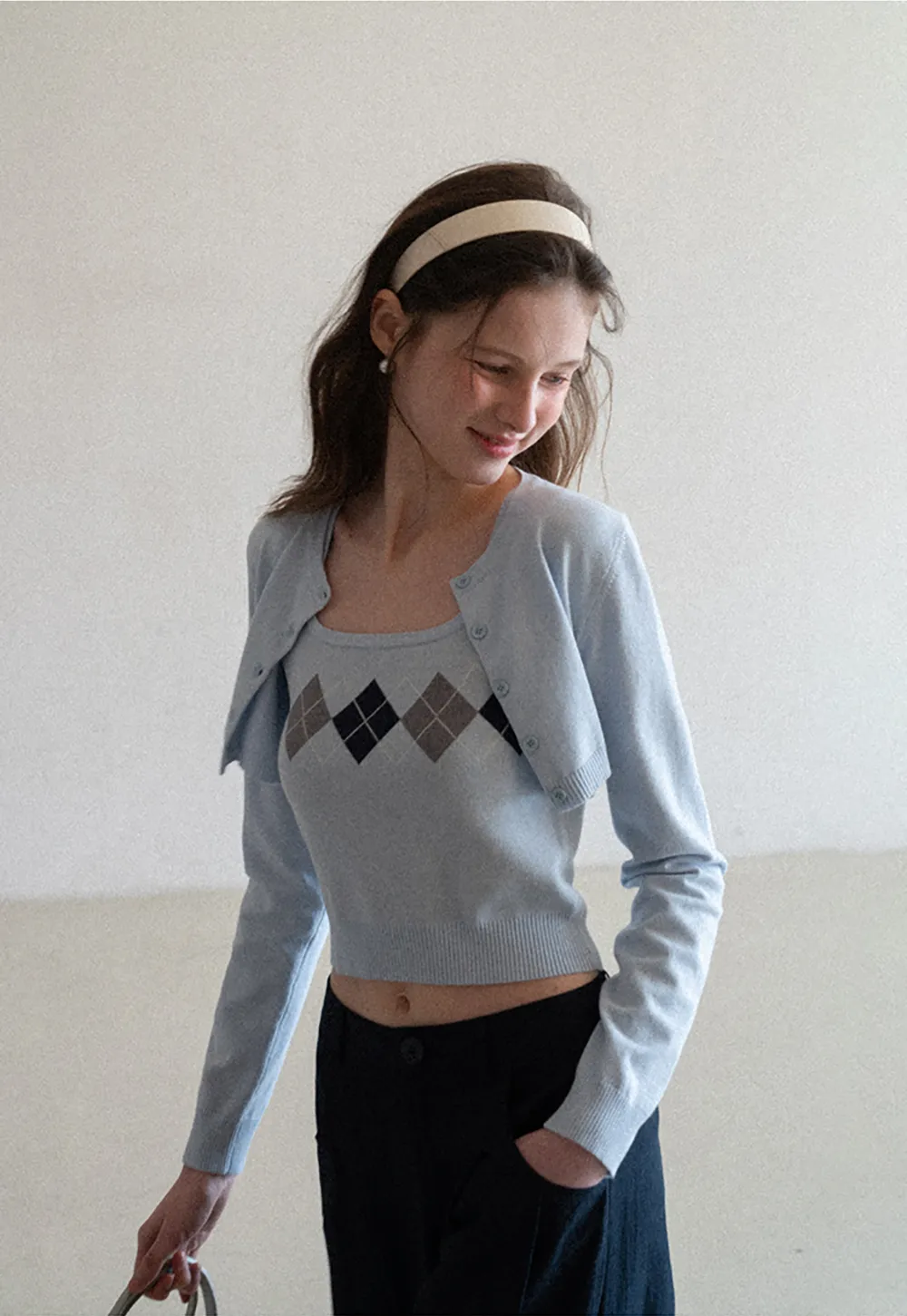 Woolen knit sweater with argyle pattern and buttons