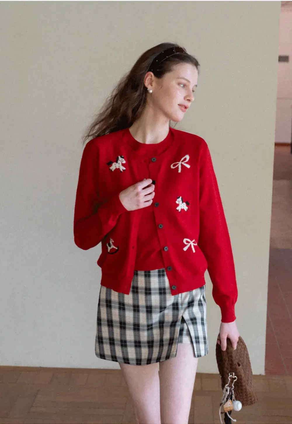 Woolen knit sweater with horse and bow motifs