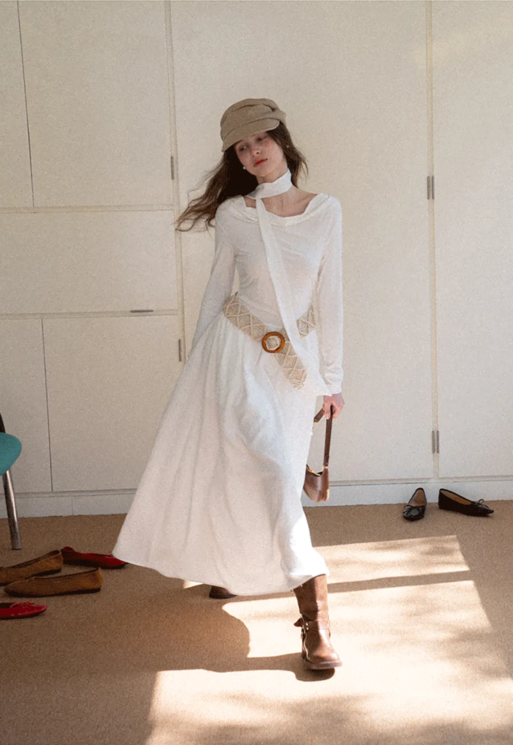 Elegant asymmetrical long sleeve dress with unique belt design