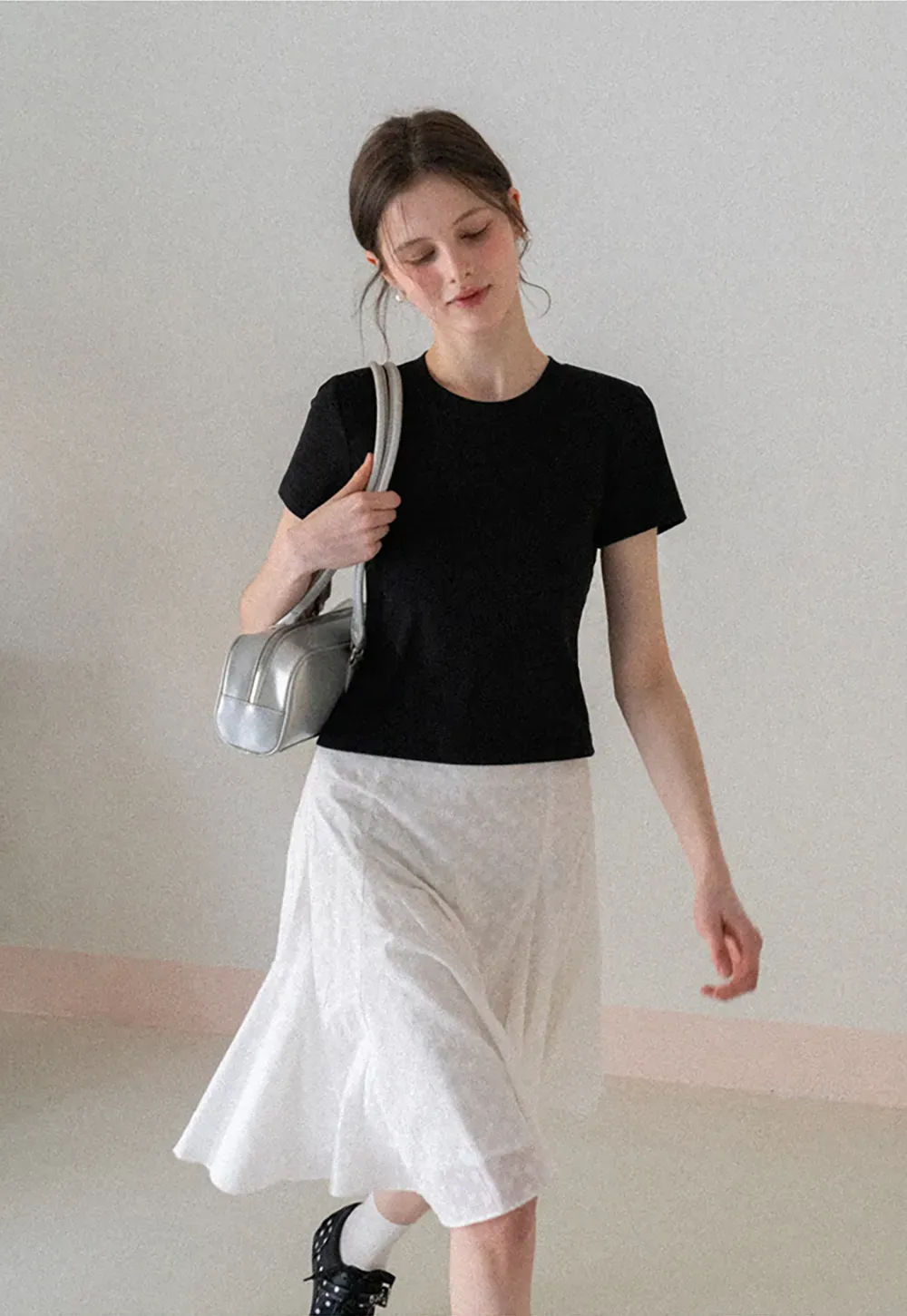 Flared pleated skirt with subtle texture