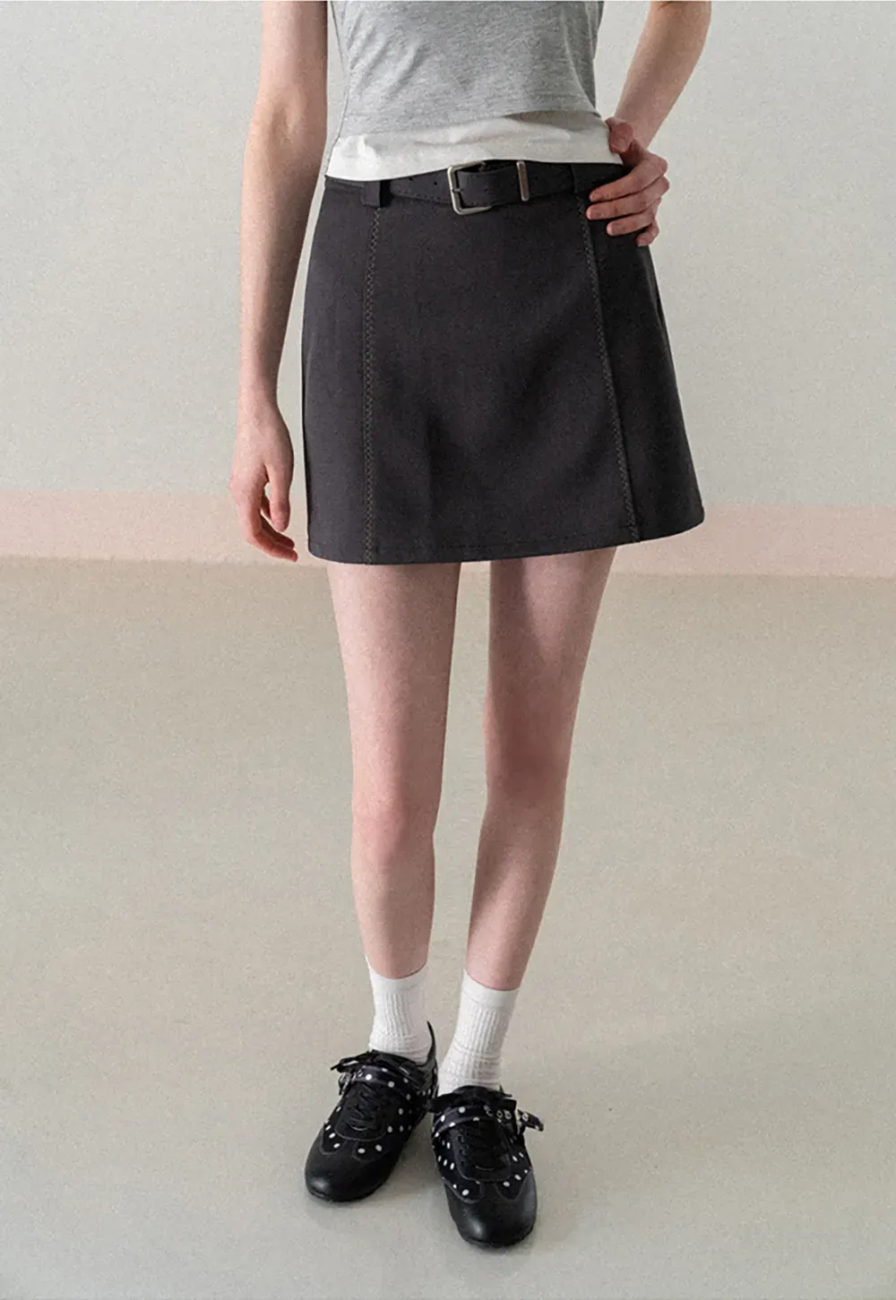 A-line mini skirt with contrast stitching and belt