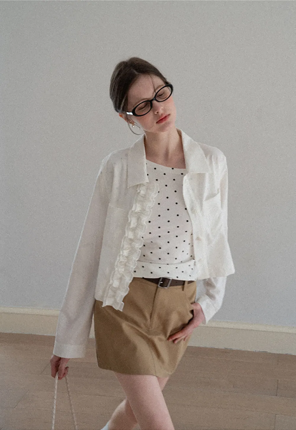 Short jacket with ruffled front placket and collar