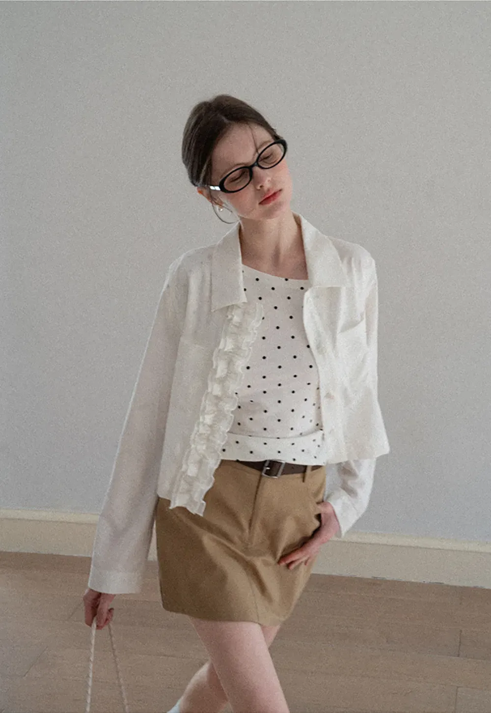 Short jacket with ruffled front placket and collar