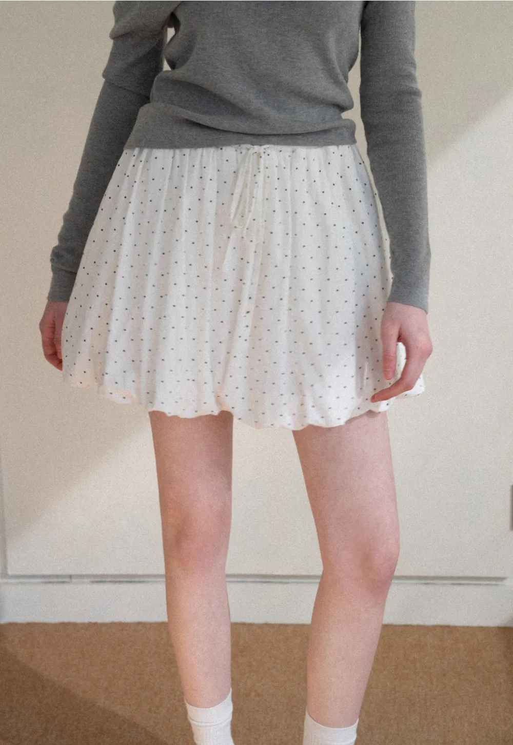 Polka dot pleated mini skirt with drawstring waist