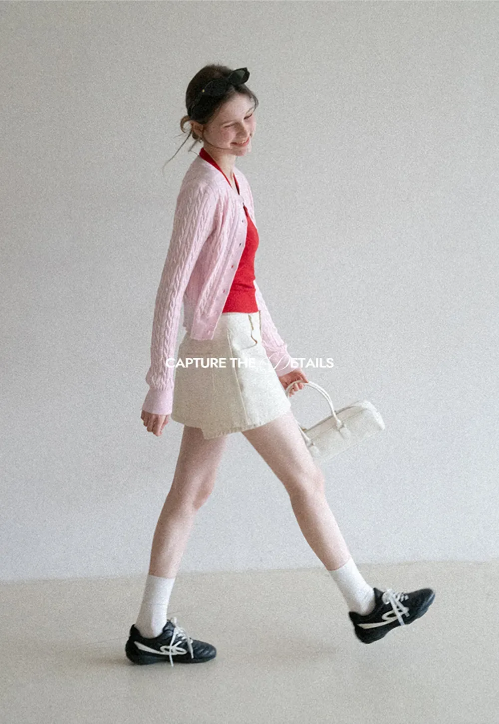 High waist pleated mini skirt with button front design