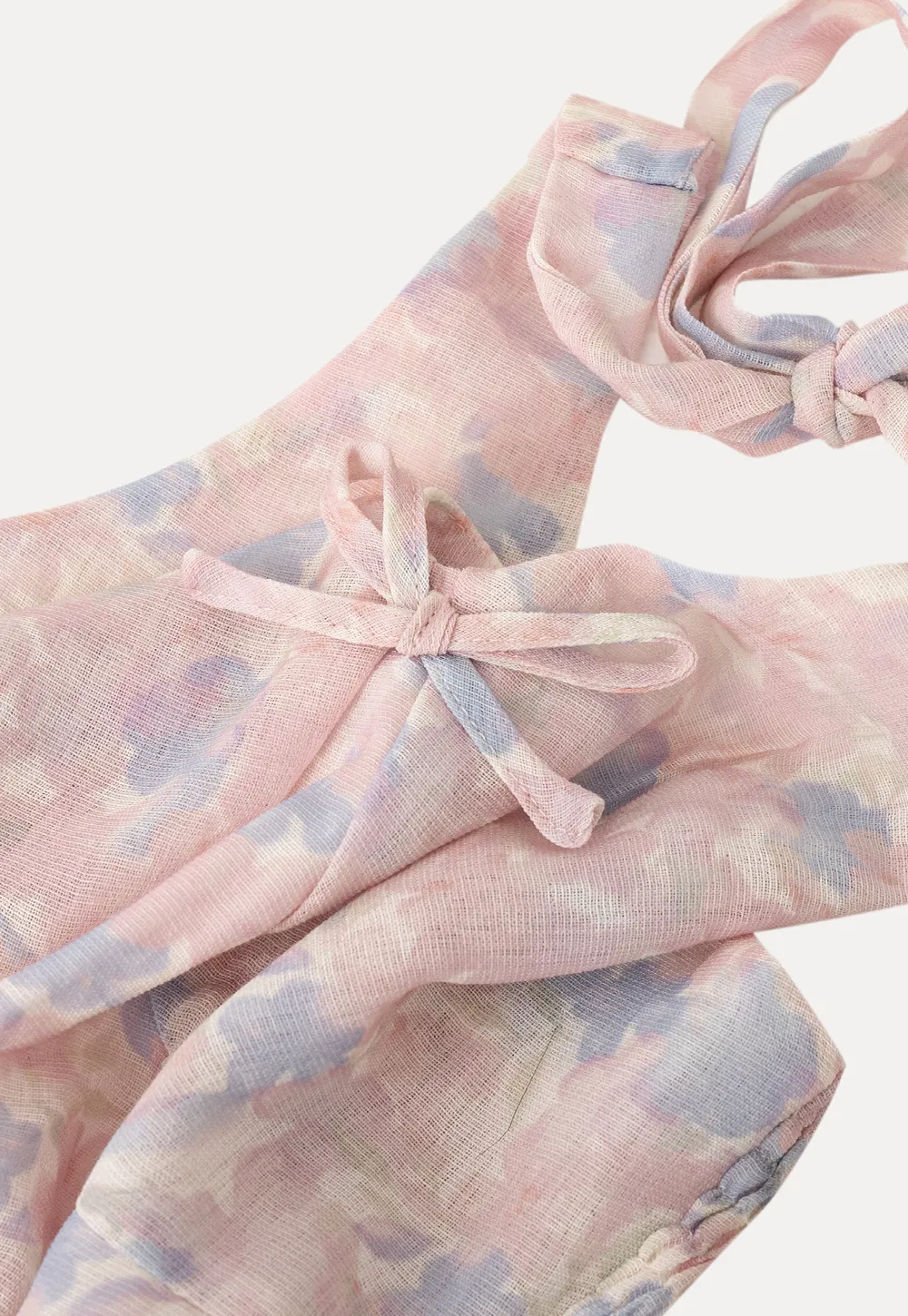 Woolen knit sweater with tie front and floral tank top