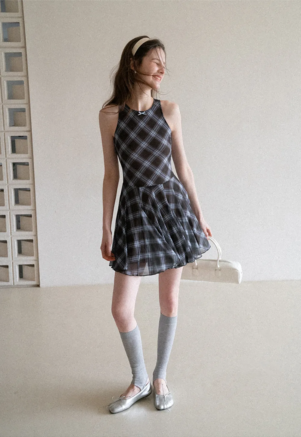 Plaid sleeveless dress with flared skirt